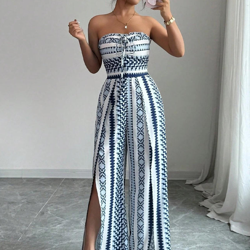 👗 47% OFF NOW! 💥 Geometric Jumpsuit with Halter Neckline & Side Slit – Unique print & elastic back – Versatile, perfect for summer parties or resort wear ✨