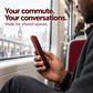 A commuter using a phone with red shimmer privacy glass, shown from a neighboring side angle.